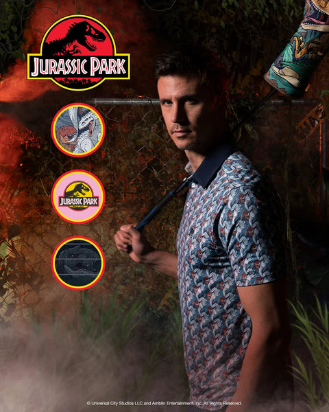 a-man-wearing-a-short-sleeve-patterned-polo-shirt-with-jurassic-park-branding-posed-in-a-dark-jungle-themed-setting-with-circular-inset-graphics-showing-shirt-details-and-the-jurassic-park-logo
