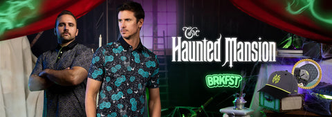 two-men-standing-in-a-themed-indoor-setting-with-red-drapes-green-glowing-accents-and-the-text-the-haunted-mansion-and-brkfst-on-a-dark-background-a-patterned-black-shirt-is-prominently-featured-on-the-right-man