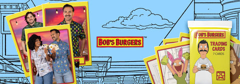 bobs-burgers-trading-cards-and-card-packs-displayed-against-a-light-blue-illustrated-background-with-cartoon-clouds-and-building-outlines-several-people-are-shown-holding-cards-in-the-left-cluster-and-one-pack-on-the-right-shows-a-character-card-while-wearing-rsvlts-x-bobs-burgers-button-down-shirts