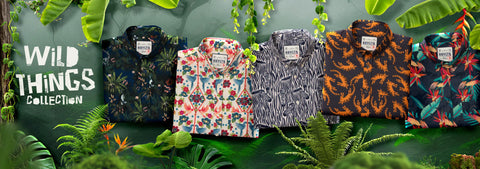 five-rsvlts-mens-kunuflex-short-sleeve-button-up-shirts-from-the-wild-things-collection-displayed-side-by-side-in-a-tropical-jungle-themed-setting-with-green-leaves-and-vines-the-shirts-feature-various-vibrant-patterns-including-floral-zebra-and-abstract-prints-in-black-orange-red-and-green