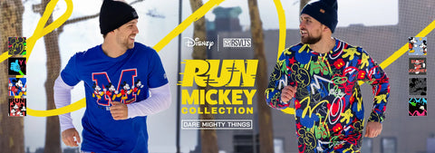 two-men-wearing-colorful-clothing-with-disney-branding-from-rsvlts-in-an-urban-setting