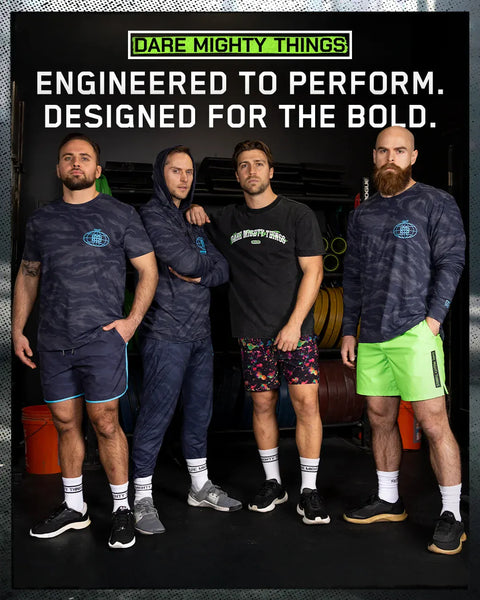 four-men-posing-together-with-fitness-equipment-in-the-background-wearing-rsvlts-athletic-wear-text-dare-mighty-things-and-slogan-engineered-to-perform