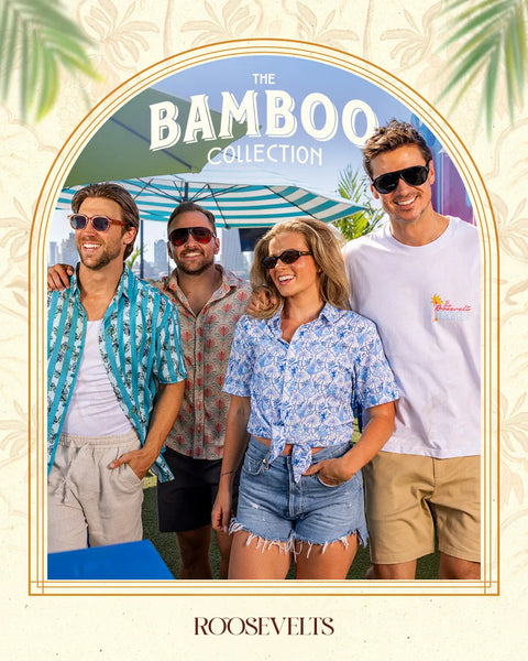 promotional-graphic-for-the-bamboo-collection-by-roosevelts-featuring-four-models-in-tropical-summer-outfits-under-a-light-blue-umbrella-framed-by-a-gold-border-on-a-cream-patterned-background-with-palm-leaves