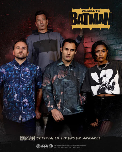 promotional-apparel-graphic-for-absolute-batman-featuring-four-cast-members-wearing-themed-batman-branded-garments-against-a-dark-textured-background-with-the-batman-logo-at-the-top