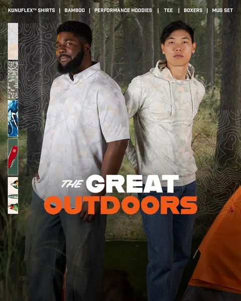 two-people-wearing-matching-hoodies-with-the-great-outdoors-text-in-a-forest-setting